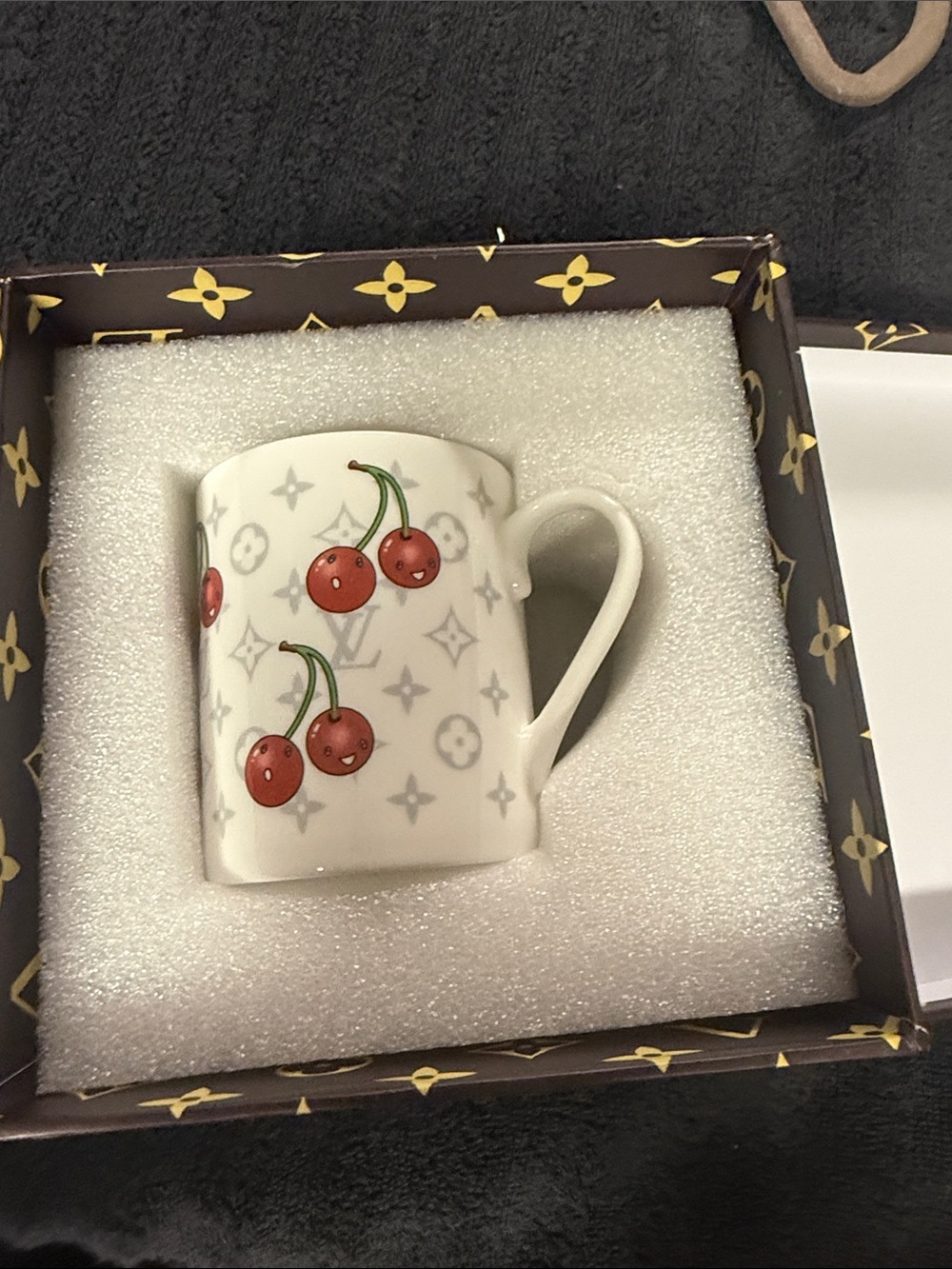 This is a Louis Vuitton x Takashi Murakami Monogram Cherry mug.